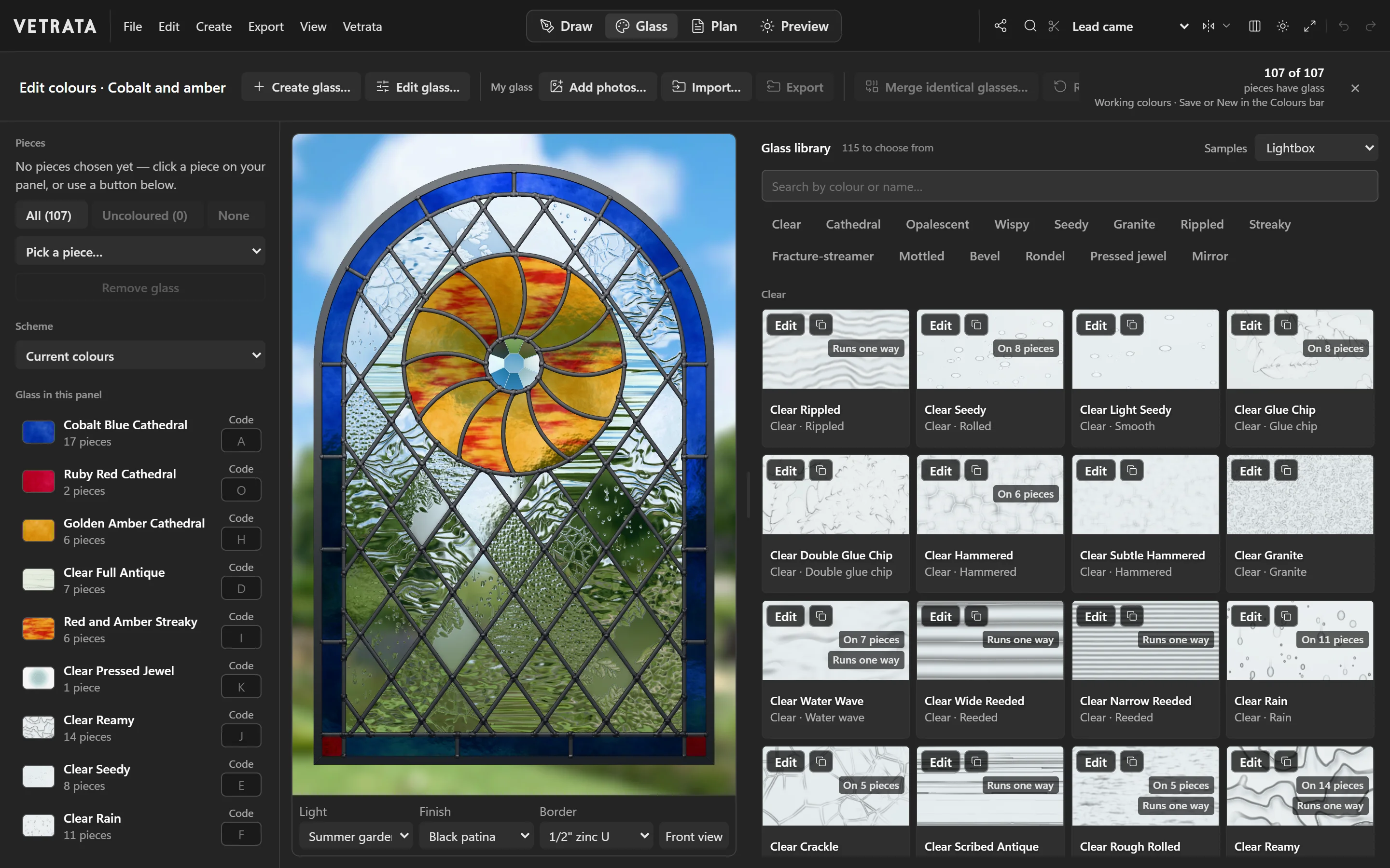 VETRATA Studio in a browser, the Sunwheel window open in its Glass tab: the glasses in the panel listed, the window glazed in a summer garden's light, and the glass library beside it.